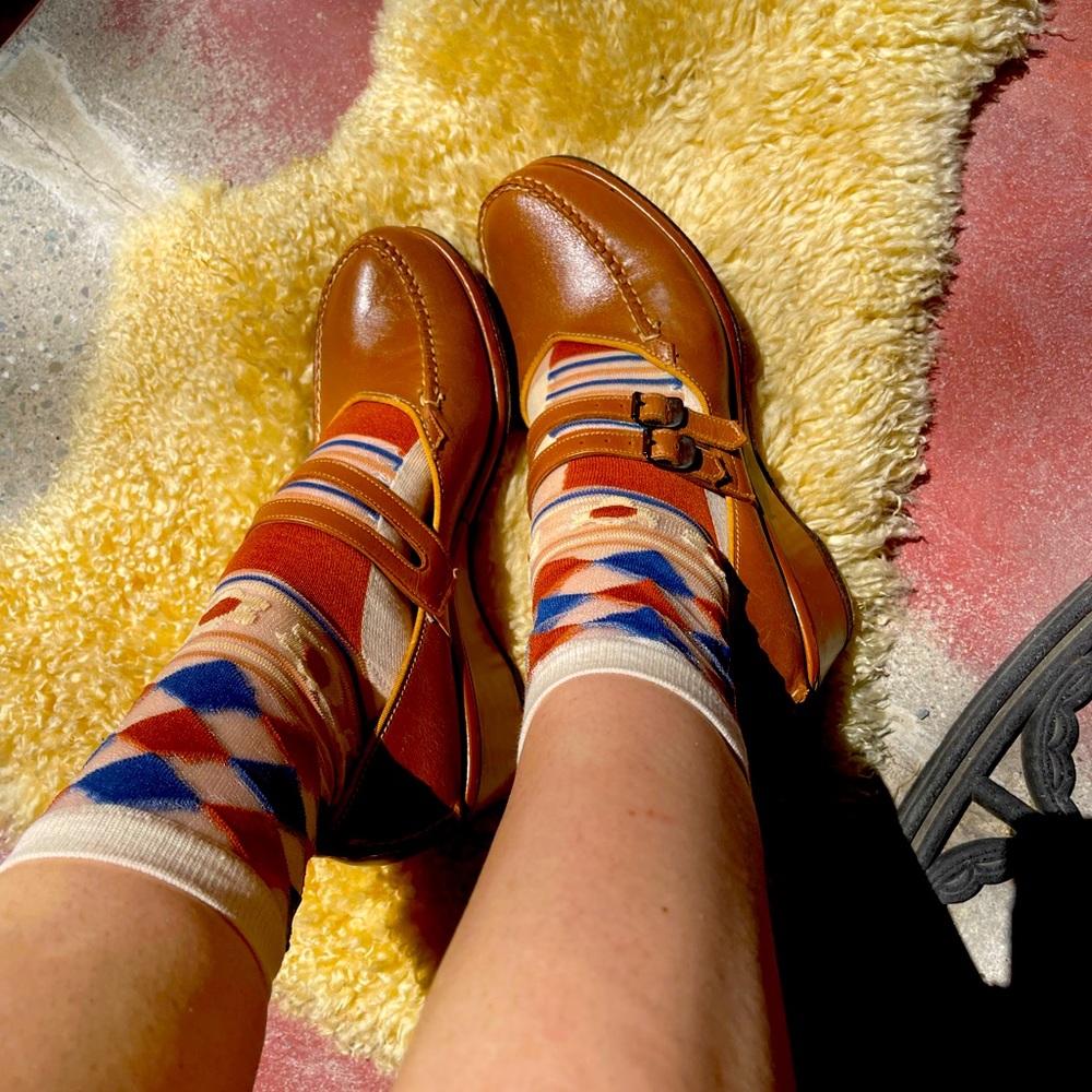 The moccasins hand sewn, log rollers